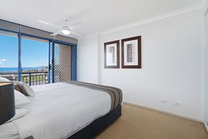 The Main Bedroom of Sandbar Apartment provides ocean views over Newcastle Beach.