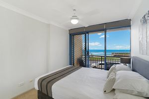 The Second Bedroom of Sandbar Apartment provides ocean views over Newcastle Beach.